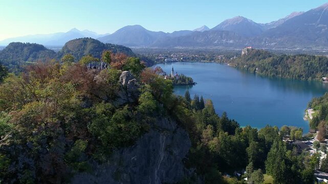 Aerial view of Lake Bled and forested hills in autumn