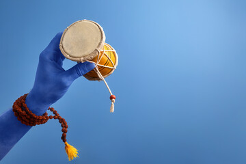 Maha Shivratri. Blue Lord Shiva hand holding damru with rudraksha mala