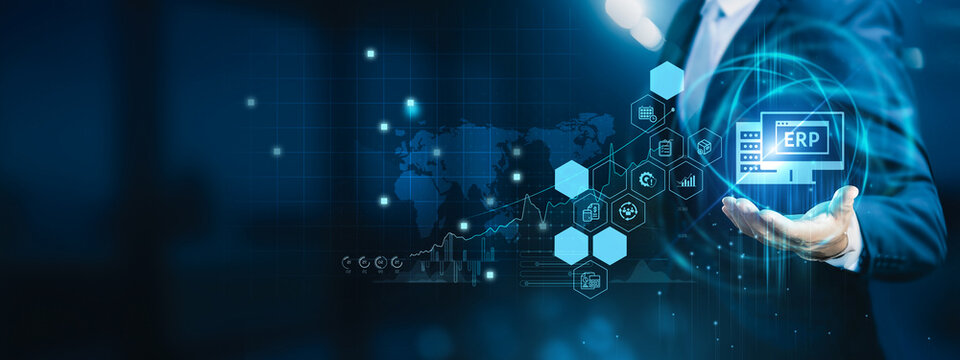 Business analyst holding ERP dashboard. ERP integrates finance, operations, HR, and supply chain into one centralized management system.