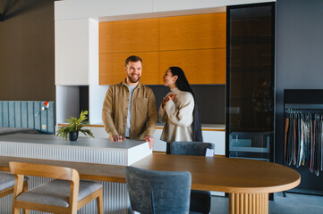 Happy couple shopping for new kitchen furniture