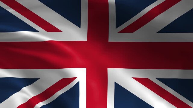 Waving Union Jack flag the national symbol of the United Kingdom fluttering in the wind with fabric texture representing patriotism and national pride