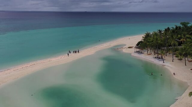 Aerial view of tropical sandbar and beach with turquoise water