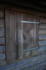 A wooden door with a latch on it