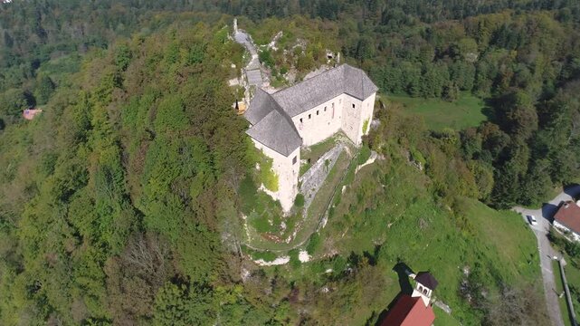 Kostel Castle Slovenia aerial view on green hill