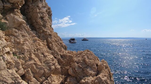 Rocky cove and boats on Adriatic Sea