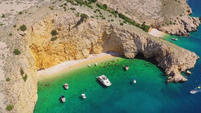 Zlata Beach cove with boats aerial view