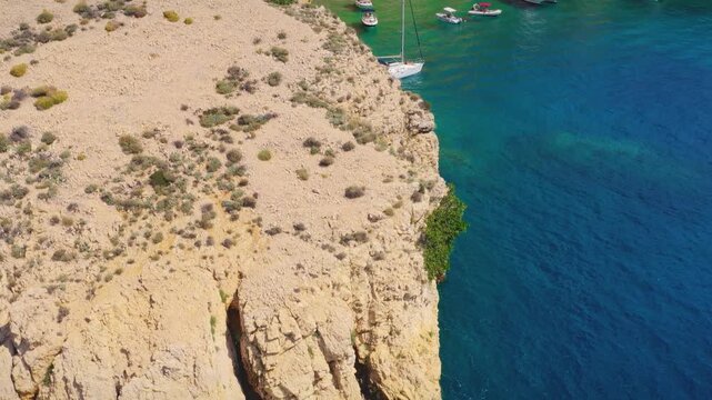 Cliffs above turquoise sea at Zlata Beach