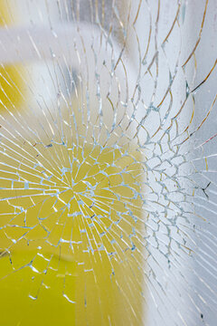 Close-up of shattered glass with abstract pattern