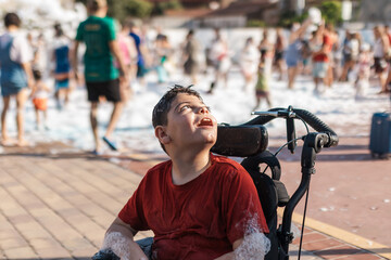 Boy with cerebral palsy enjoying inclusive foam party