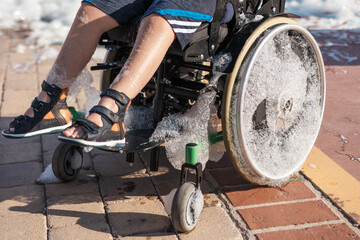 Child with cerebral palsy enjoying inclusive foam party