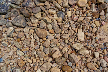 Dry riverbed rocks and stones closeup