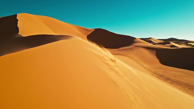 Vast Sahara Desert Dunes Under Clear Blue Sky - Golden Sand Patterns and Landscape