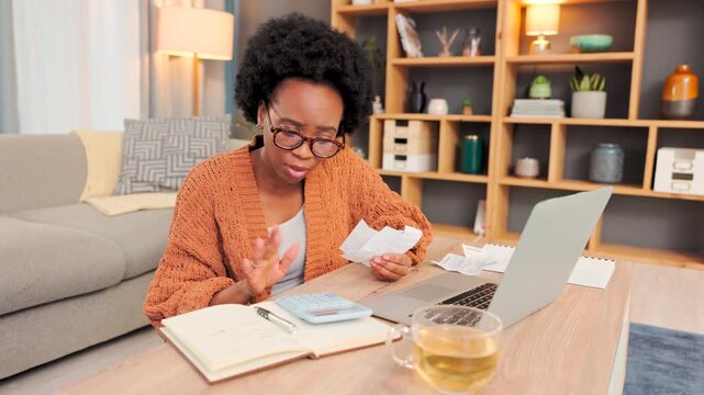 Confused, stressed and frustrated woman trying to make a loan or rent payment. Annoyed, upset and worried female feeling anxious while budgeting at home with a laptop, notebook and receipts