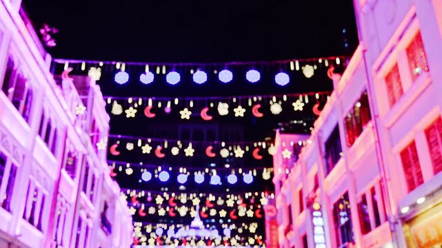 string of lights between buildings in guangzhou, china