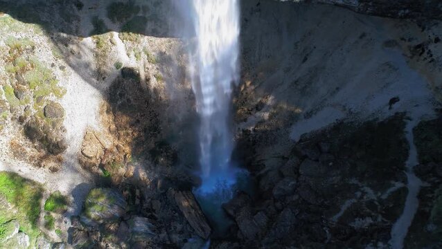 Pericnik Waterfall and rocky cliffs aerial view