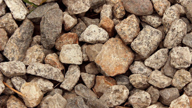 Rough masonry stones and loose aggregate used for building construction
