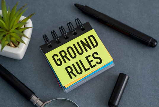 On gray background - bright multicolored stickers with the text GROUND RULES. Business Concept