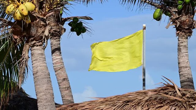 Yellow flag blowing in the wind