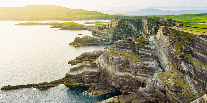 Amazing wave lashed Kerry Cliffs, widely accepted as the most spectacular cliffs in County Kerry, Ireland. Tourist attractions on Ring of Kerry route.