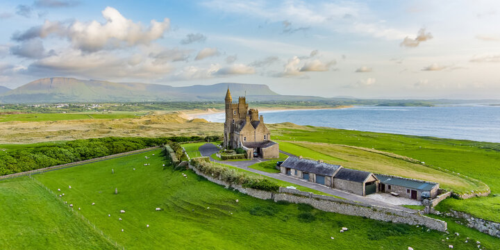 Classiebawn Castle on a backdrop of picturesque landscape of Mul