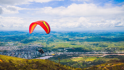 Parapent flying over the sky. World Capital of Free Flight. Governor Valadares. Championship of parapent. © Jobe