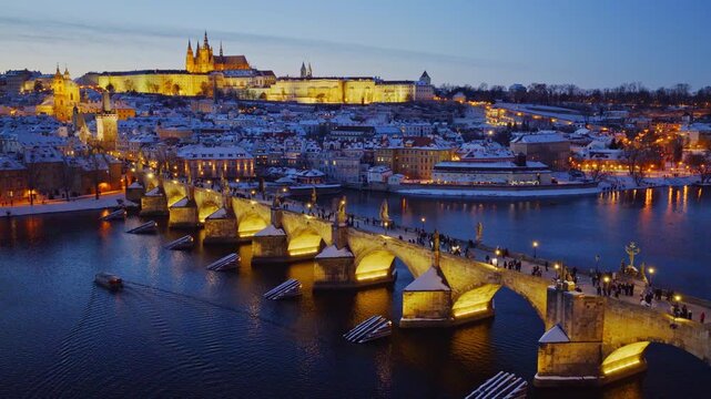 High Resolution Panorama Picture of Winter Snowy Prague Old Town with Prague Castle and Charles Bridge above River Vltava during Sunset , Czech republic