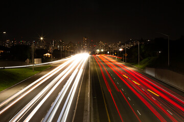 Fototapeta premium Oahu, Honolulu Hawaii Night Highway Light Trails and Urban Speed, Fast Traffic Motion on City Road After Dark 