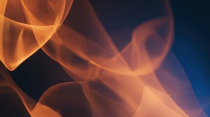 Subtle orange and golden shapes gracefully flow across a dark blue and black canvas, forming a dynamic, smoke-like abstract design. The soft light creates depth and movement