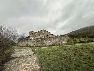 San Martin de Tours Church in Vidrieros with stone wall and cemetery crosses