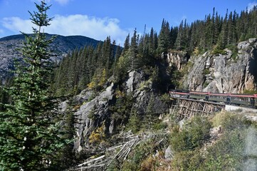 an old train entering a tunnel on the way to the Yukon
