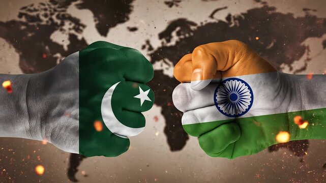 Two fists with national flags clashing