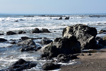Tar Pits With Waves Rolling Over Rocks in the Ocean