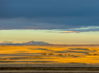 Stormy winter sunrise over the prairies and mountains in Aurora, Colorado