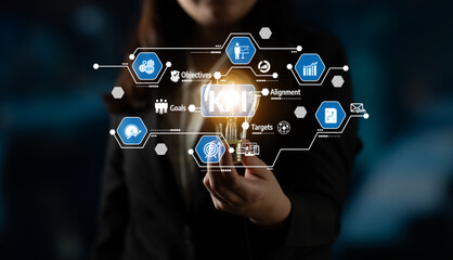 Fototapeta premium A business professional holds a light bulb symbolizing innovation, surrounded by a digital interface of objectives, goals, and key performance indicators, emphasizing strategic planning. Tessel