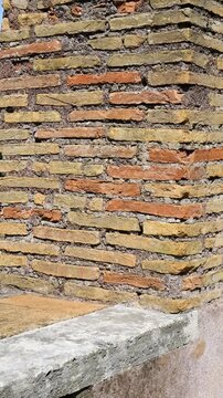 alternating yellow terracotta masonry forms roman brick battlement narrow embrasures these layered defensive constructions offer views distant arches castel sant'angelo rome italy brickwork 