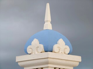 Skillfully crafted artistic image of decorative blue dome with finial beneath turbulent weather conditions © Vladimir