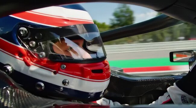 Cinematic Side Angle Close-Up of a Driver with Racetrack Reflected on Helmet Visor During Race