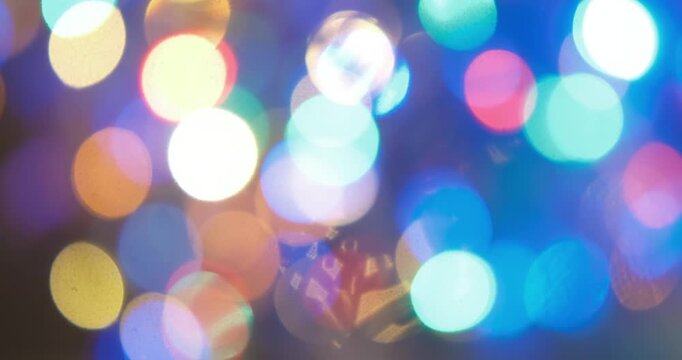Festive abstract background featuring holiday lights rendered as soft circular bokeh in full defocus, New Year, Christmas, birthdays, weddings, parties, and seasonal promotions