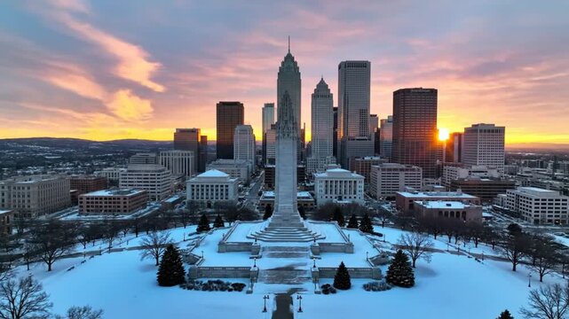 Aerial view of downtown Tulsa, Oklahoma with the Boston Avenue Methodist Church and snow-covered park at sunrise