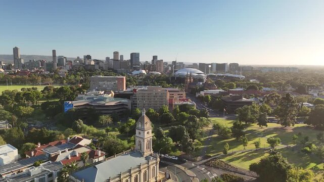 North Adelaide, South Australia: 4K Aerial Drone Footage of Brougham Place Uniting Church, CBD, Towers, Parklands, Suburban Houses, Residential Estates, City Landscape at Sunset