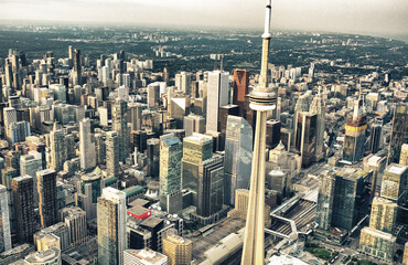 Naklejka premium Aerial view of Toronto skyline from helicopter on a beautiful summer sunset, Ontario - Canada