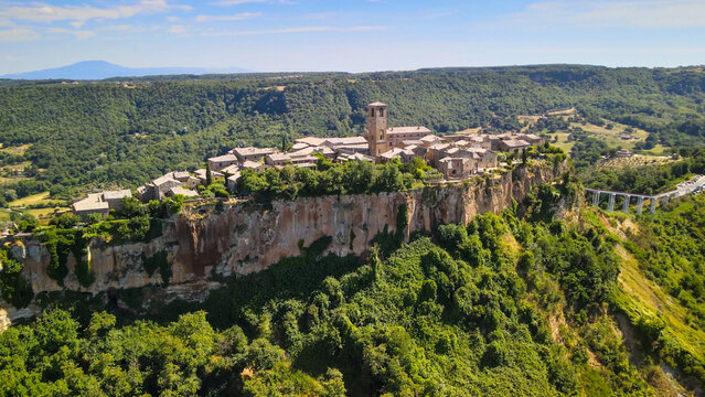 Panoramic aerial view of Civita di Bagnoregio from a flying drone around the medieval city, Italy.