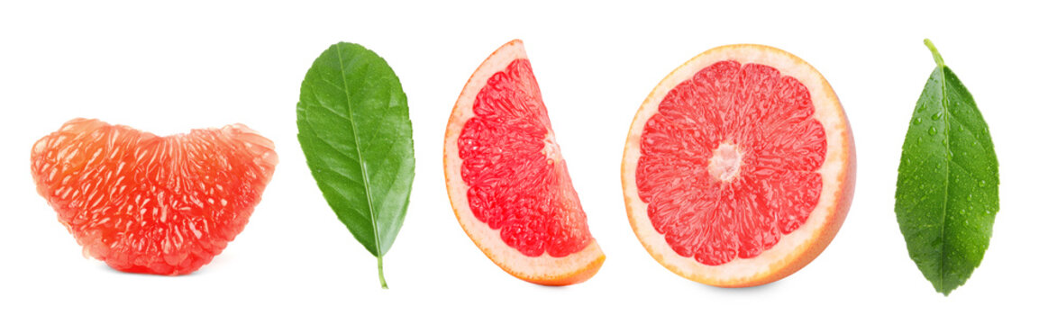Fresh juicy grapefruit pieces and green leaves isolated on white, set