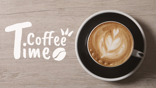 Coffee break time. Hot aromatic beverage in cup on wooden table, top view