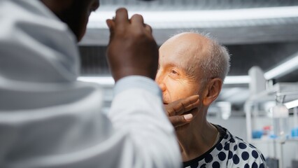 Medic in a clinical research procedure testing older patient with new pills, monitoring reactions...