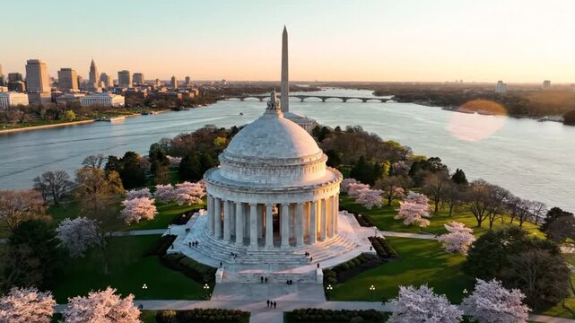 Aerial view of the Memorial Circle in a spring sunset with blooming cherry trees and skyline background