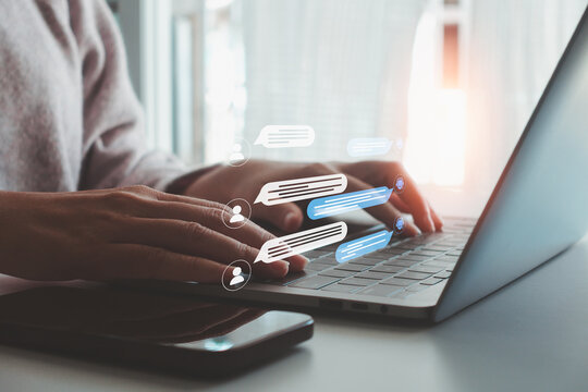 Woman hands typing on laptop with virtual chat bubble and user icon. Concept of online communication, AI chatbot, customer support, messaging technology, digital conversation, modern business service.