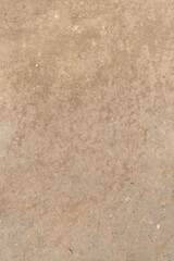 old stone wall detail. concrete surface with weathered rust on top.