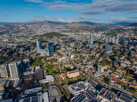 Beautiful aerial view of Tegucigalpa, capital of Honduras, surrounded by mountains and the city glowing across the urban valley