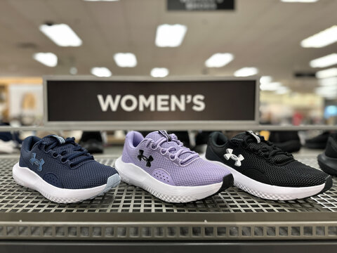 Livonia, Michigan, USA - 10 Jan 2026 : Stylish Under Armour brand sport shoes or footwear is displayed at a shelf at Kohls department store